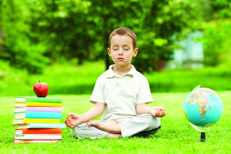 Beautiful child in zen meditation