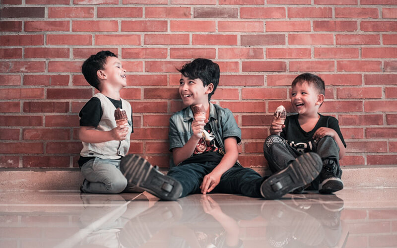 group of kids enjoying ice-cream together - helps in developing Social Skills and a shy child socialize