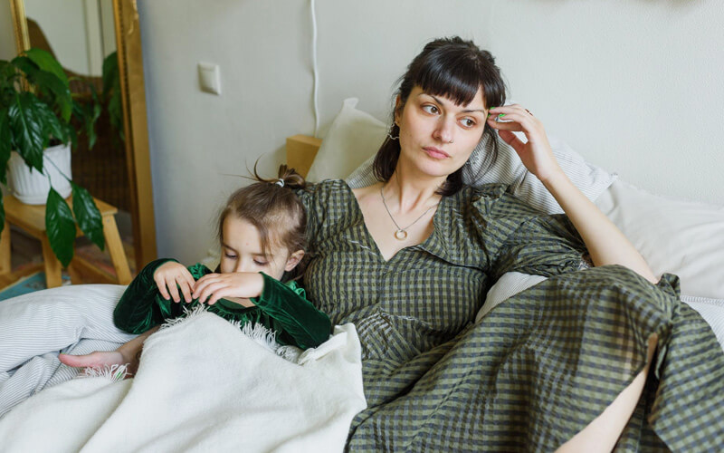 mother and kid sitting together